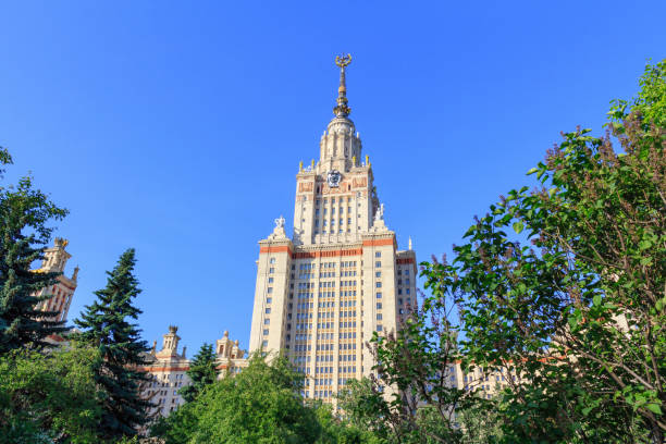 istock Moscow State University (MSU) in sunny summer evening on a green trees background 976996920