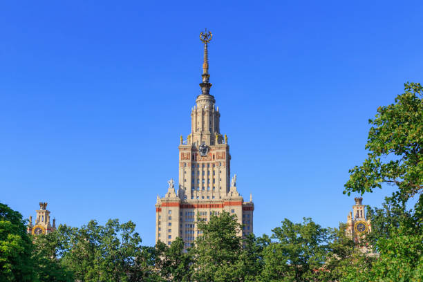 istock Moscow State University (MSU) on a blue sky background in sunny summer evening 976996978