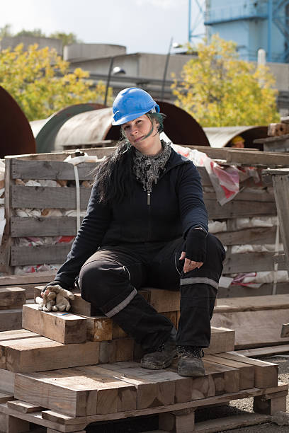 istock Female manual worker in blue hard hat 97701219