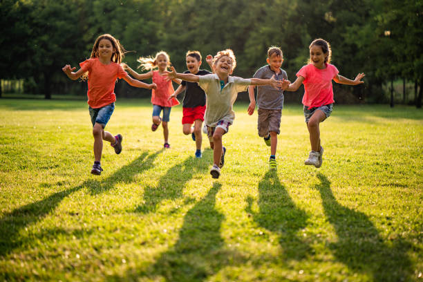 istock Happy kids running in nature to camera 977012320