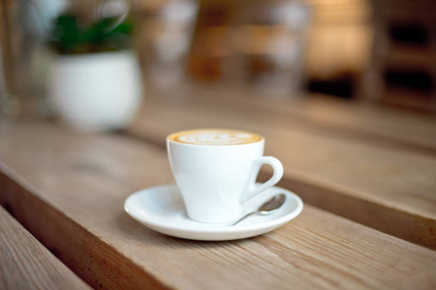 istock cup of coffee on wooden table 977018430