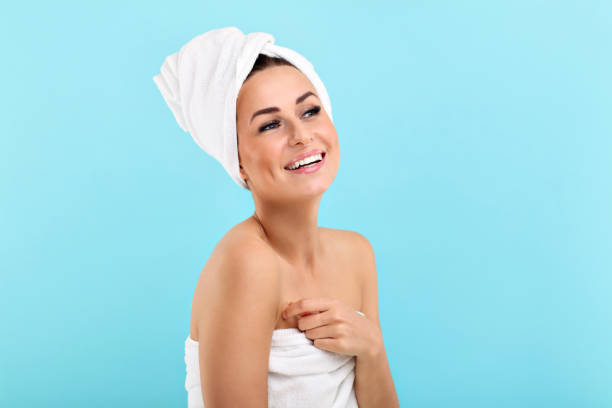 istock Spa skin care beauty woman with towel over blue background 977018564