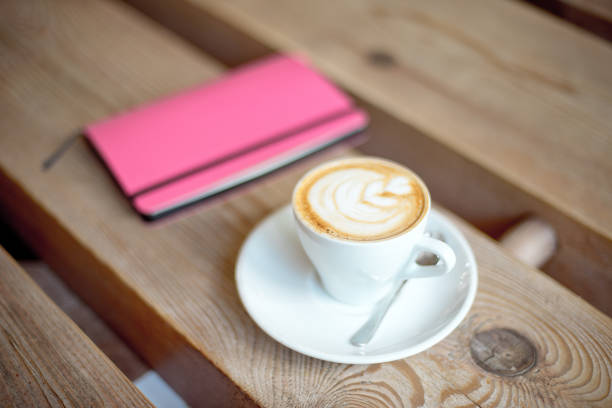 istock cup of coffee on wooden table 977018904