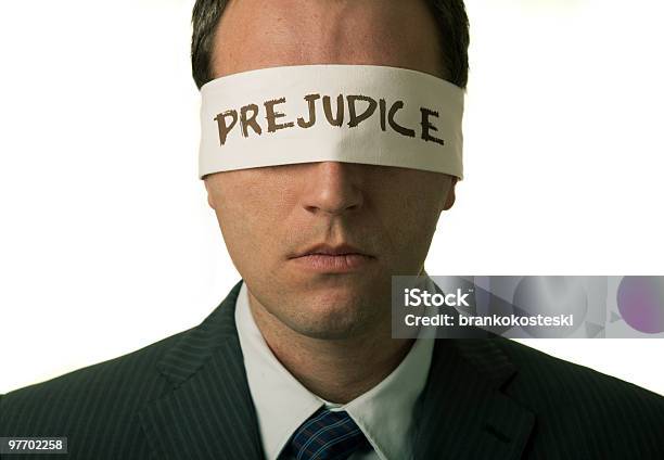 Man With A Note That Says Prejudice Stock Photo - Download Image Now - Blindfold, Prejudice, Adult