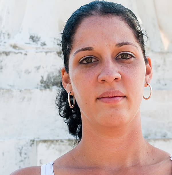 istock Young Cuban woman with silver earings 97702287