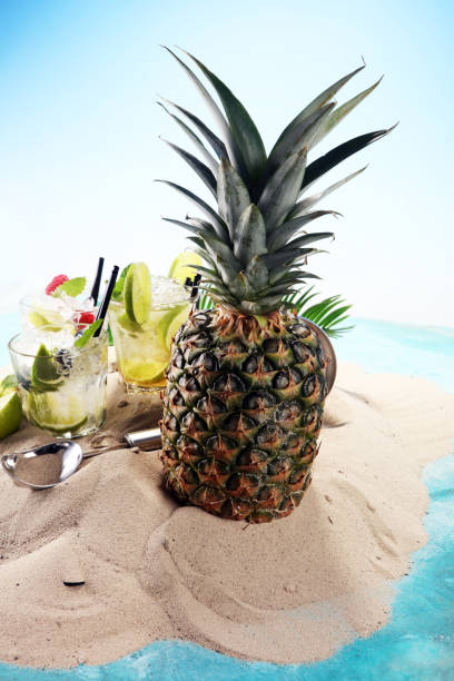 istock Different types of mojito cocktail on the beach. 977025592