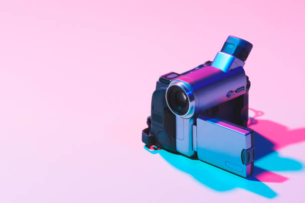 close up view of digital video camera on pink background close up view of digital video camera on pink background vintage video camera stock pictures, royalty-free photos & images