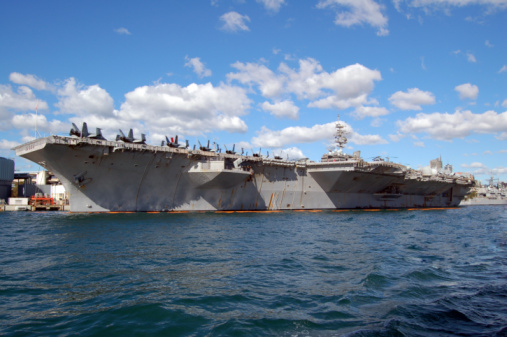 United States Navy Aircraft Carrier at Dock -