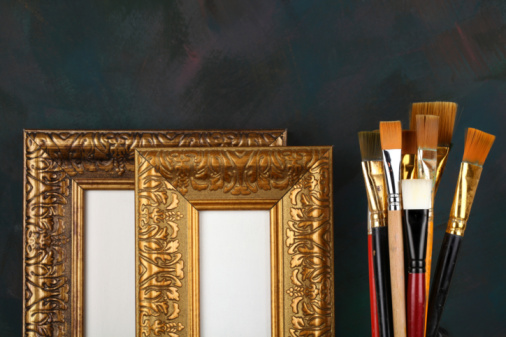 antique frame and paintbrushes