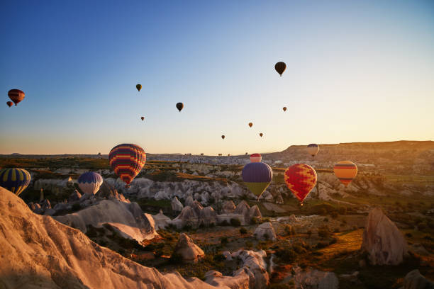istock Hot Air Balloons Flying at Sunset, Cappadocia, Turkey 977108652