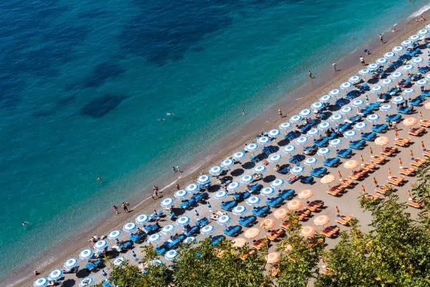 Photo of Positano Amalfi Coast Neaples Italy - Abstract view of beach with beach umbrella rows.