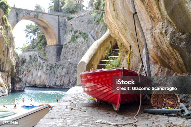 Fiordo Di Furore Beach Furore Fjord Amalfi Coast Positano Naples Italy Fishermen Red Boat On The Beach Under The Bridge Of The Fjord The Turquoise Water Of The Beach Stock Photo - Download Image Now