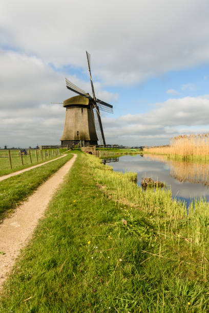 istock Windmill on canal in West Friesland, Netherlands 977119800