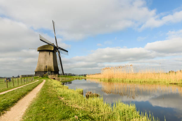 istock Windmill on canal in West Friesland, Netherlands 977119926