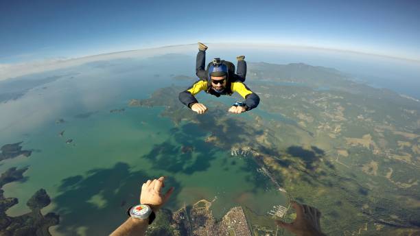 istock Skydiver point of view above the beach 977145252
