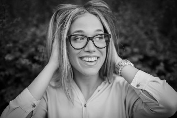 istock Happy pretty smiling girl with eyeglasses 977153150