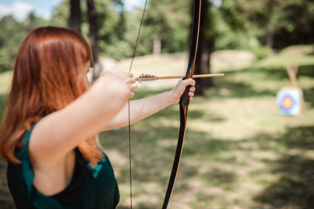 istock Female archer in the fieald 977158976