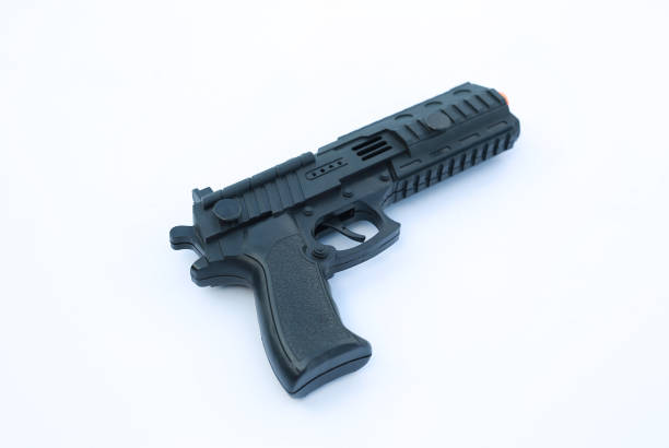 istock Plastic toy gun for child isolated on white background. 977163282