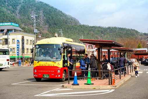 Yamanashi Japan - April 2, 2018 : Kawaguchiko Station, Unidentified japanese and tourists are using the tour bus service. transportation is very convenient for both train and bus.