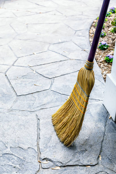 istock Old-Fashioned Straw Broom and Maple Seed Helicopters 977172242