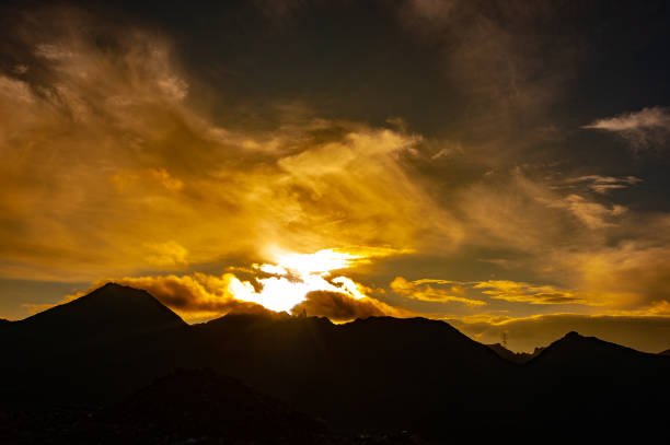 istock sunset above the mountains - sichuan,china 977211400
