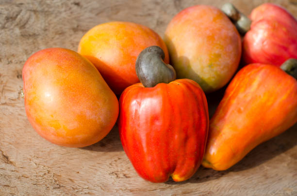 Some ripe mangoes and cashew fruits