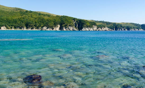 Beautiful blue water bay, crystal clean water, blue sky Beautiful blue water bay, crystal clean water falmouth harbor stock pictures, royalty-free photos & images