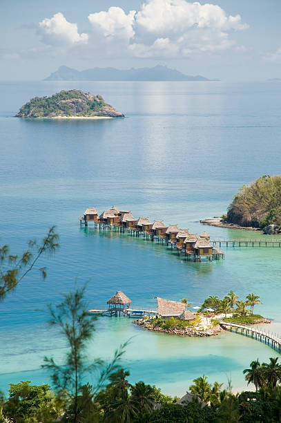 Tropical ocean resort with huts in the water