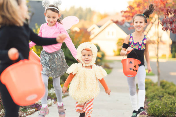 istock Multiethnic group of kids trick or treating 977251516