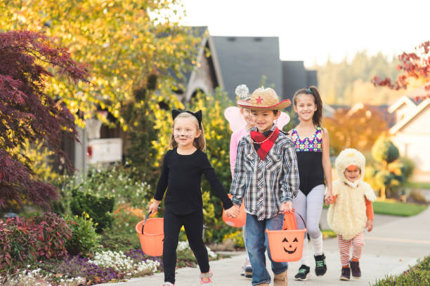 istock Multiethnic group of kids trick or treating 977251524