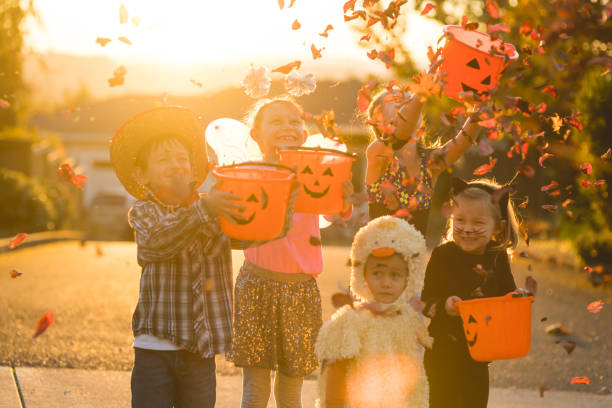 istock Multiethnic group of kids trick or treating 977251526