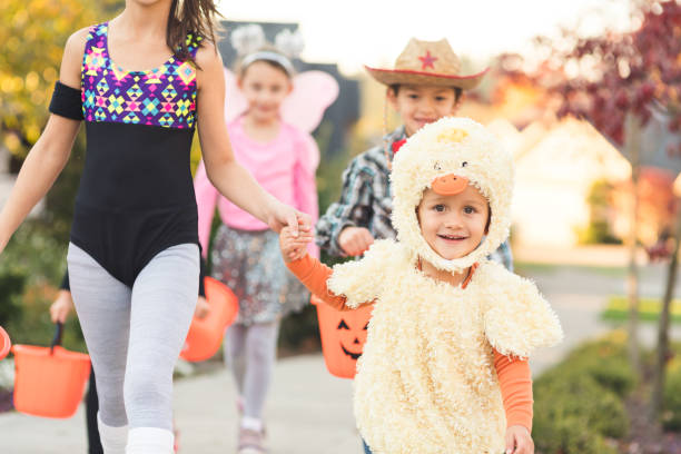 istock Multiethnic group of kids trick or treating 977251532