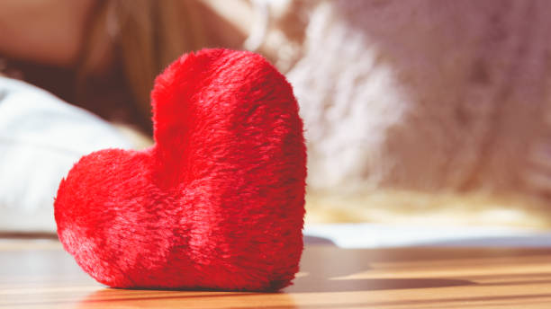 istock Close up of heart shaped red pillow 977252742