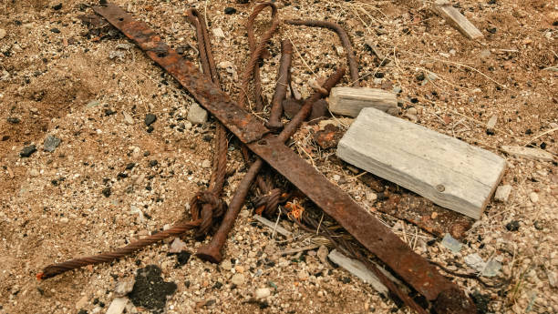 istock Old rusted metal details on the sand 977265134