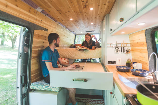 Millennial couple living in a van