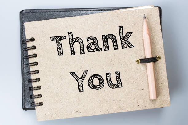 istock Thank you, Text message on brown Notebook / business concept 977276382