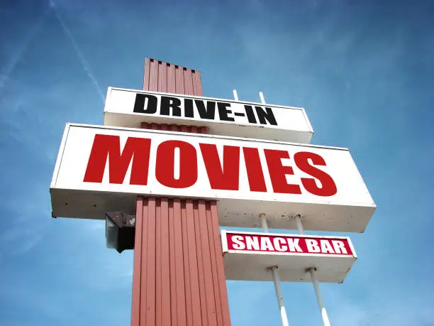drive in movies and snack bar sign