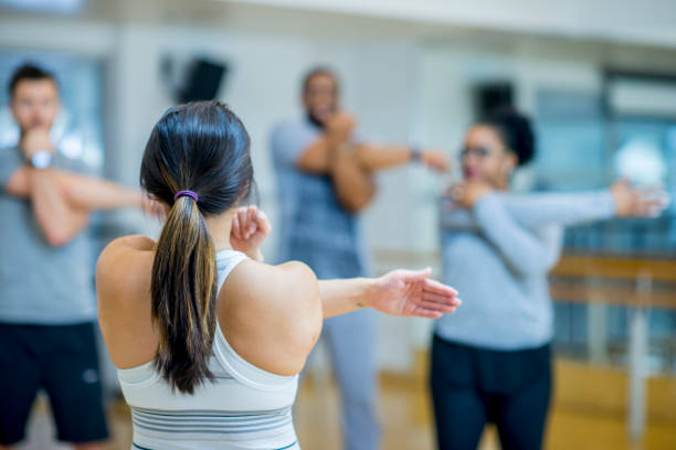 istock Stretching as a group in the gym 977288110