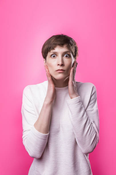 istock Wow. Beautiful female half-length front portrait isolated on pink studio backgroud 977288566
