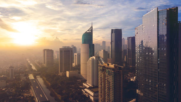 Beautiful Jakarta cityscape under light of sunset JAKARTA - Indonesia. May 21, 2018: Beautiful Jakarta cityscape with high buildings under light of sunset jakarta stock pictures, royalty-free photos & images