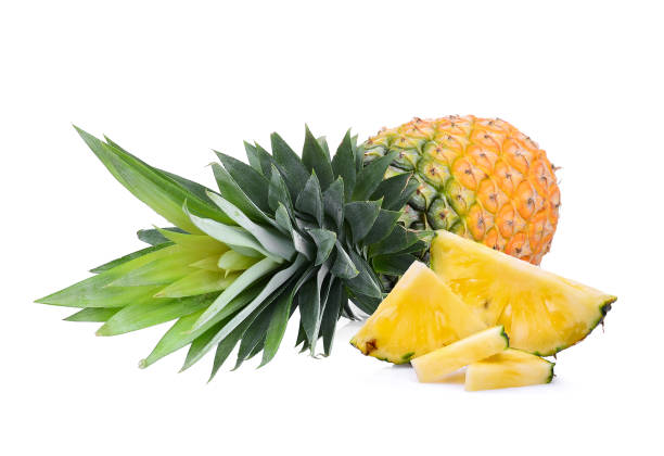 istock whole with slice ripe pineapple isolated on white background 977292044