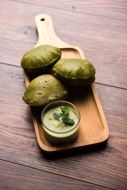 istock Palak Puri or Spinach Poori, indian breakfast food, selective focus 977292074