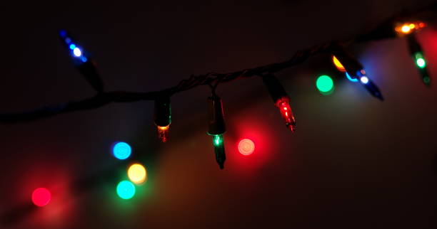 istock Close-Up Of Illuminated String Lights At Night 977297244