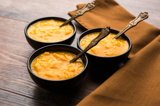 istock Mango Pulp / Aam rus or Ras served in small bowls, selective focus 977297298