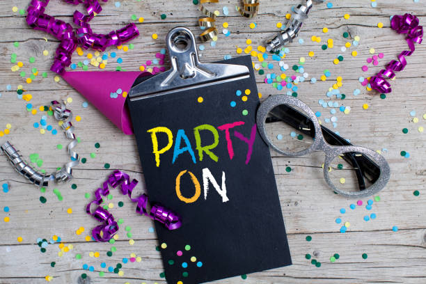 istock Close-Up Of Multi Colored Confetti And Clipboard On Table 977303646