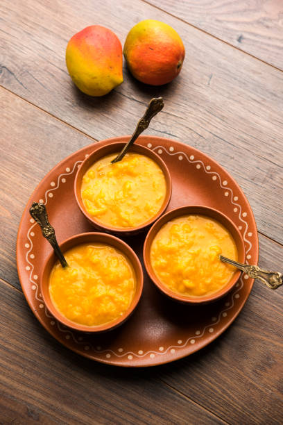 istock Mango Pulp / Aam rus or Ras served in small bowls, selective focus 977304554