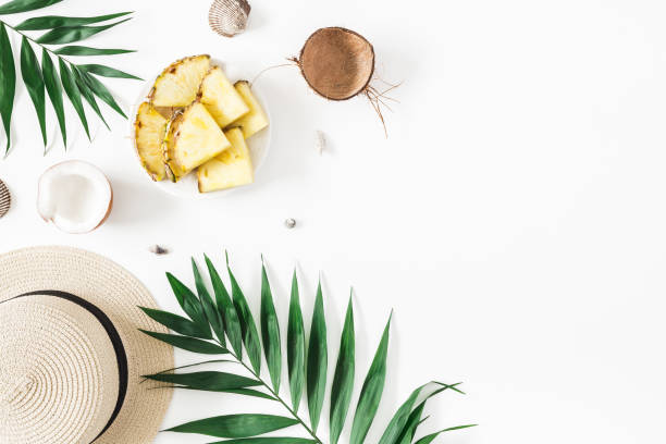 istock Tropical palm leaves, hat, pineapple, coconut. Summer concept 977308178