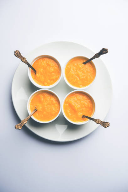 istock Mango Pulp / Aam rus or Ras served in small bowls, selective focus 977308216