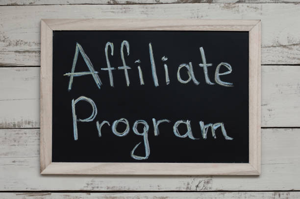 istock Affiliate Program concept. Affiliate marketing. Blackboard with handwritten text, top view 977308496