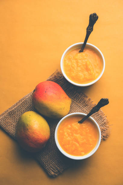 istock Mango Pulp / Aam rus or Ras served in small bowls, selective focus 977311386